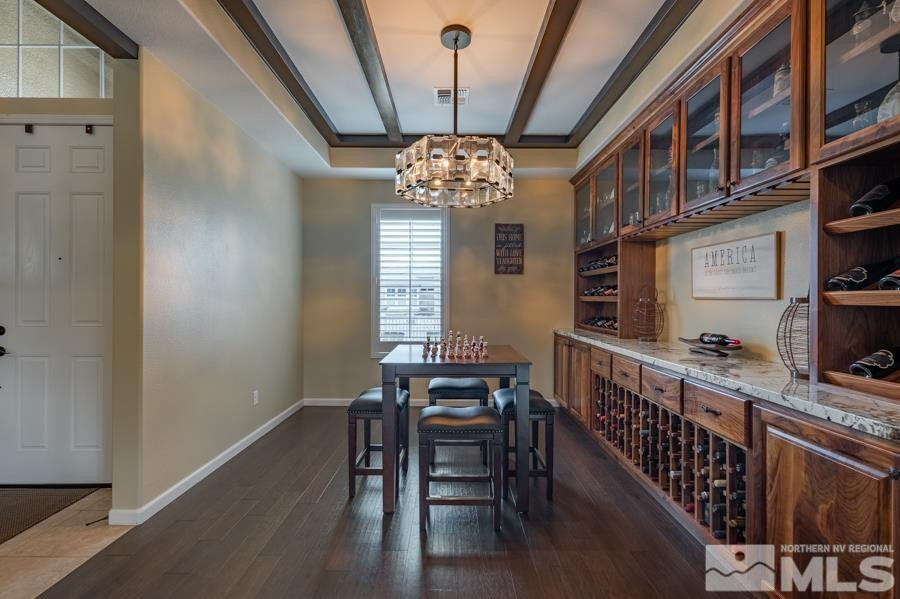 9898 Firefoot Lane Reno, NV 89521 - Photo 8 of 40 a view of a dining room with furniture window and wooden floor