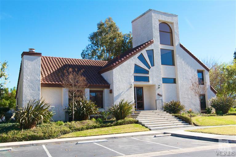 1742 Sinaloa Road, Unit 335 Simi Valley, CA 93065 - Photo 2 of 28 a front view of a house with a yard and garage