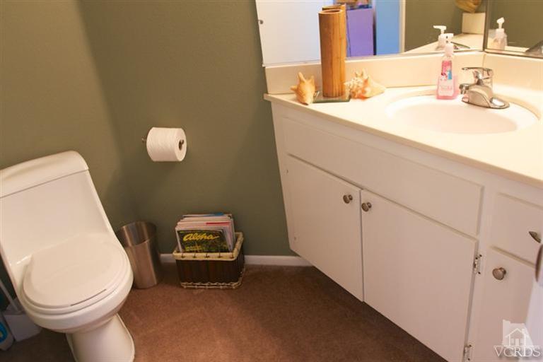 1742 Sinaloa Road, Unit 335 Simi Valley, CA 93065 - Photo 15 of 28 a bathroom with a sink and a toilet