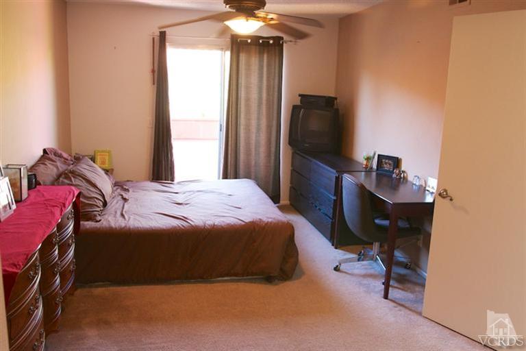 1742 Sinaloa Road, Unit 335 Simi Valley, CA 93065 - Photo 20 of 28 a bedroom with a bed and a television