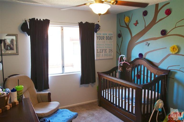 1742 Sinaloa Road, Unit 335 Simi Valley, CA 93065 - Photo 21 of 28 a bedroom with furniture and a window