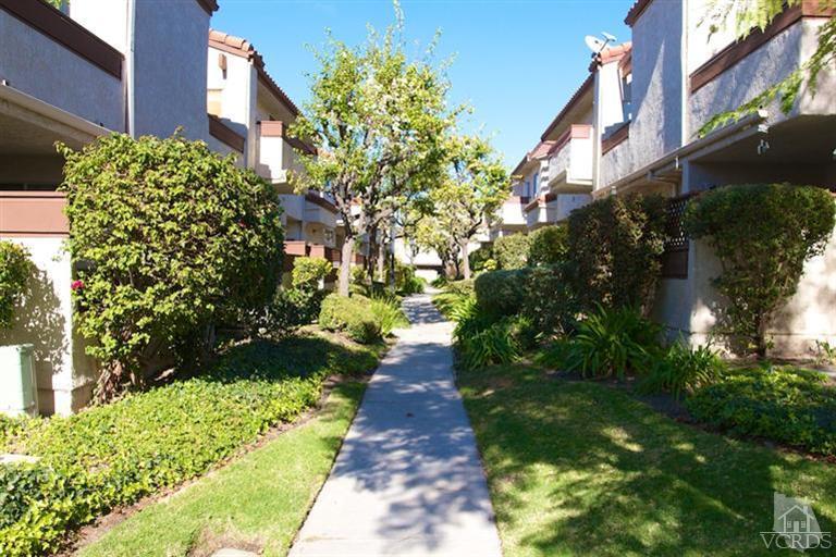 1742 Sinaloa Road, Unit 335 Simi Valley, CA 93065 - Photo 6 of 28 a view of a pathway both side of white house