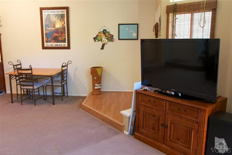 1742 Sinaloa Road, Unit 335 Simi Valley, CA 93065 - Photo 10 of 28 a living room with furniture and a flat screen tv