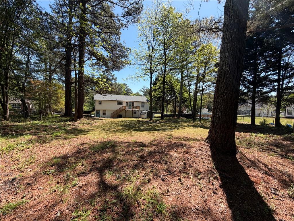 934 Bay Ridge Drive Lawrenceville, GA 30045 - Photo 10 of 78 a view of a yard with trees