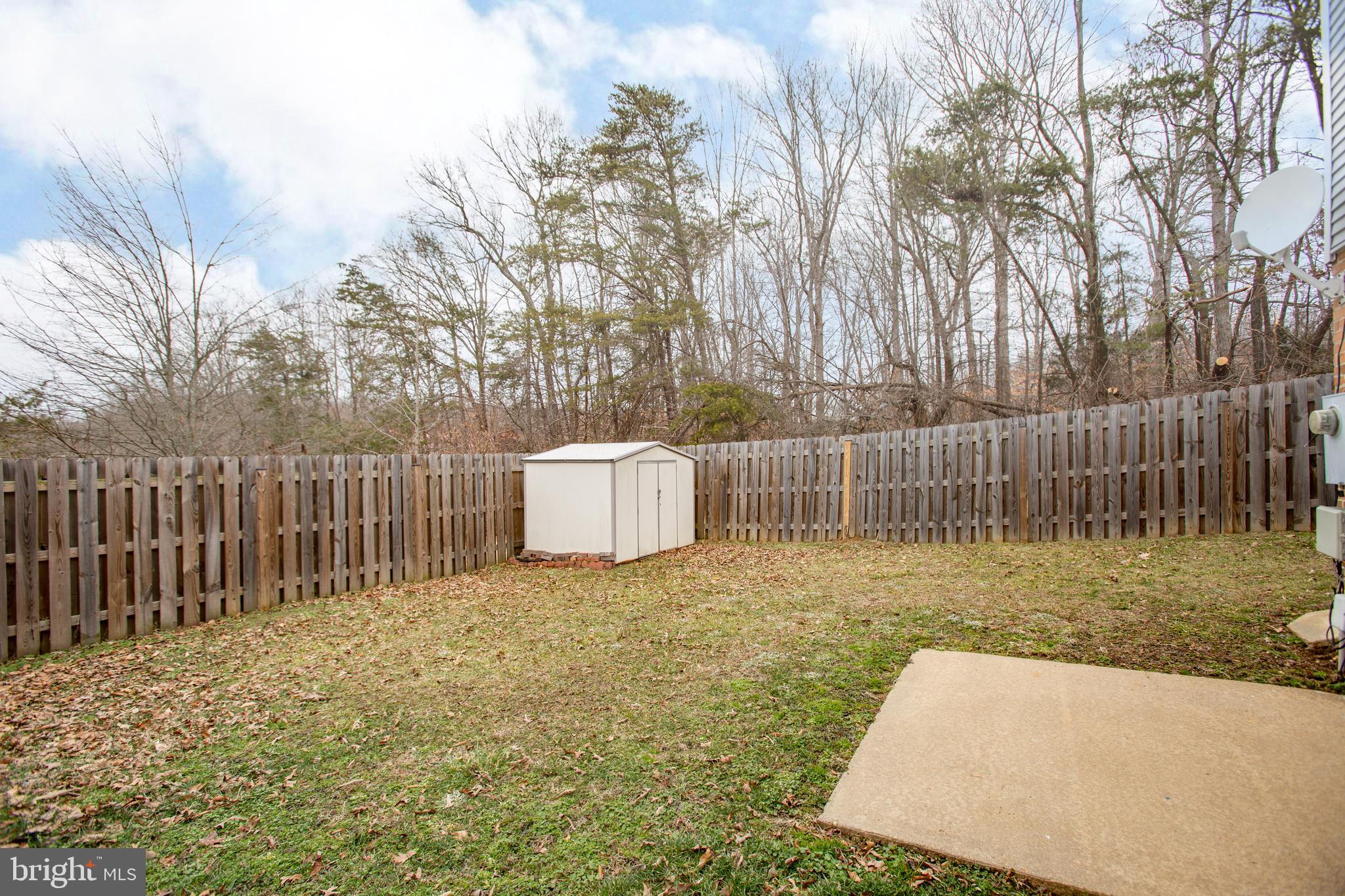 300 Windsor Ridge Court Fredericksburg, VA 22405 - Photo 30 of 35 Fenced yard, patio & storage shed w/ treeline view