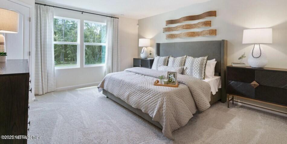 63 Blue Hvn Road St. Augustine, FL 32095 - Photo 7 of 24 a bedroom with a bed and window