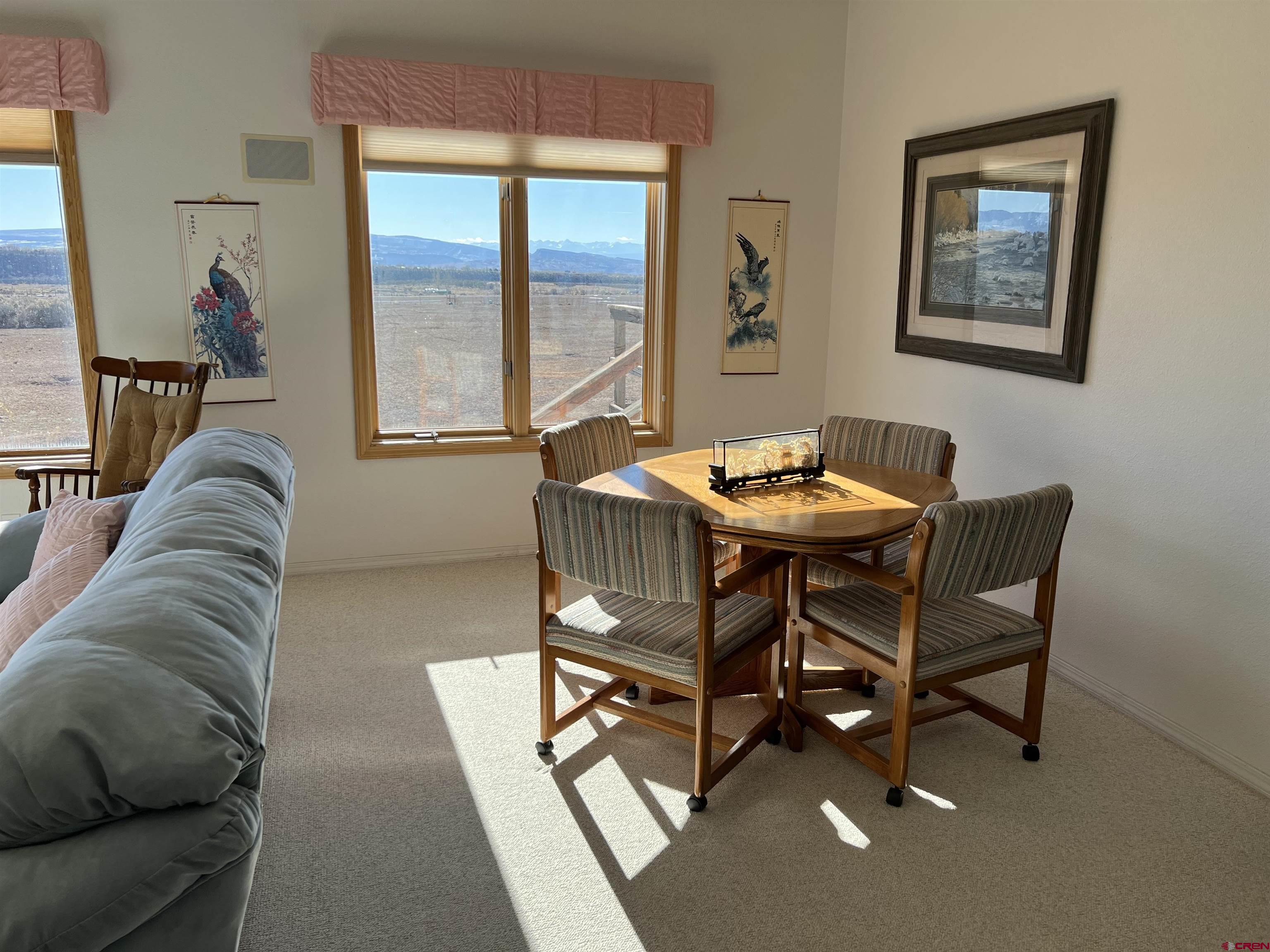 26096 Paintbrush Road Cedaredge, CO 81413 - Photo 12 of 29 a living room with furniture and a window