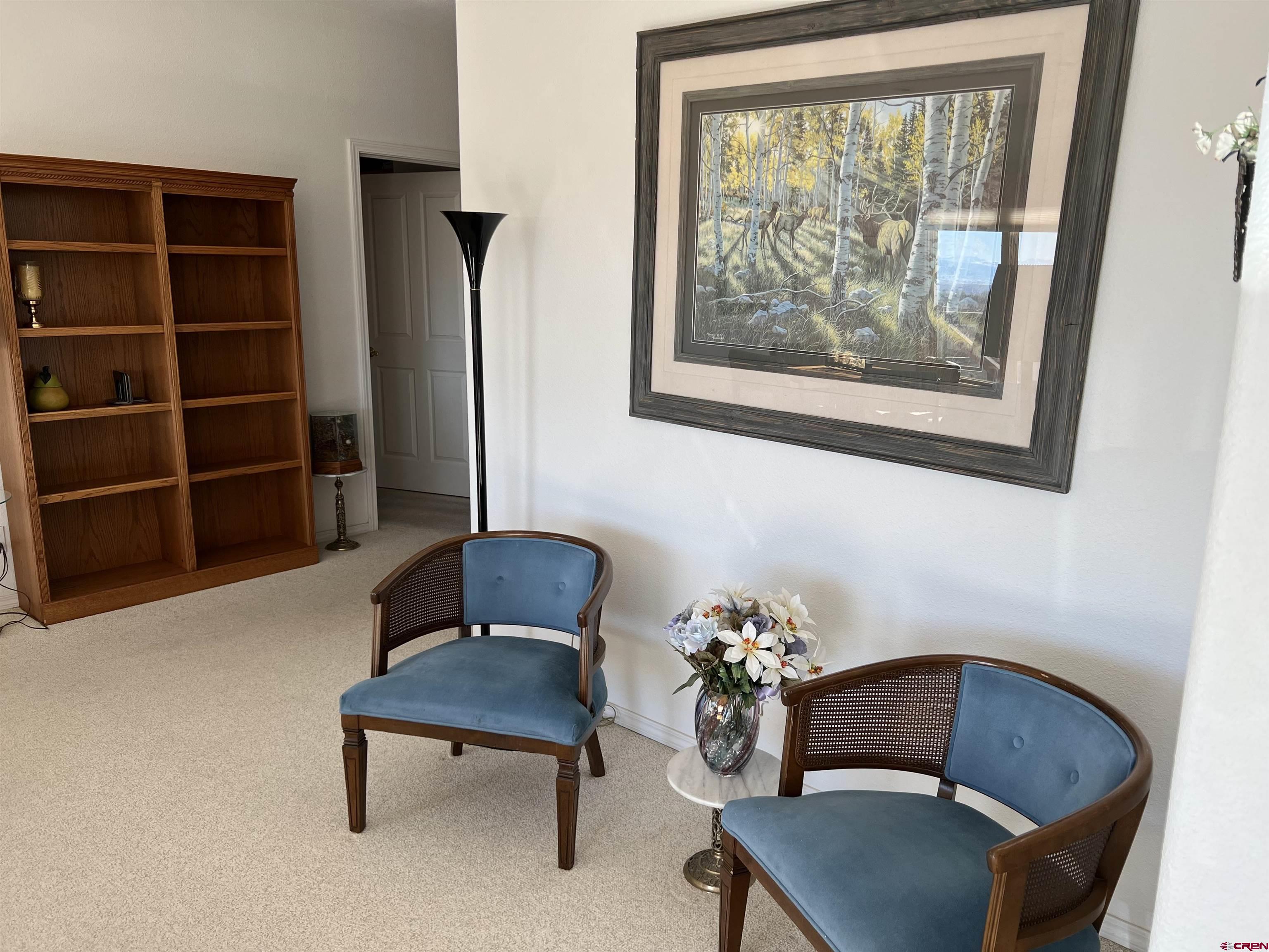 26096 Paintbrush Road Cedaredge, CO 81413 - Photo 13 of 29 a living room with furniture and a potted plant