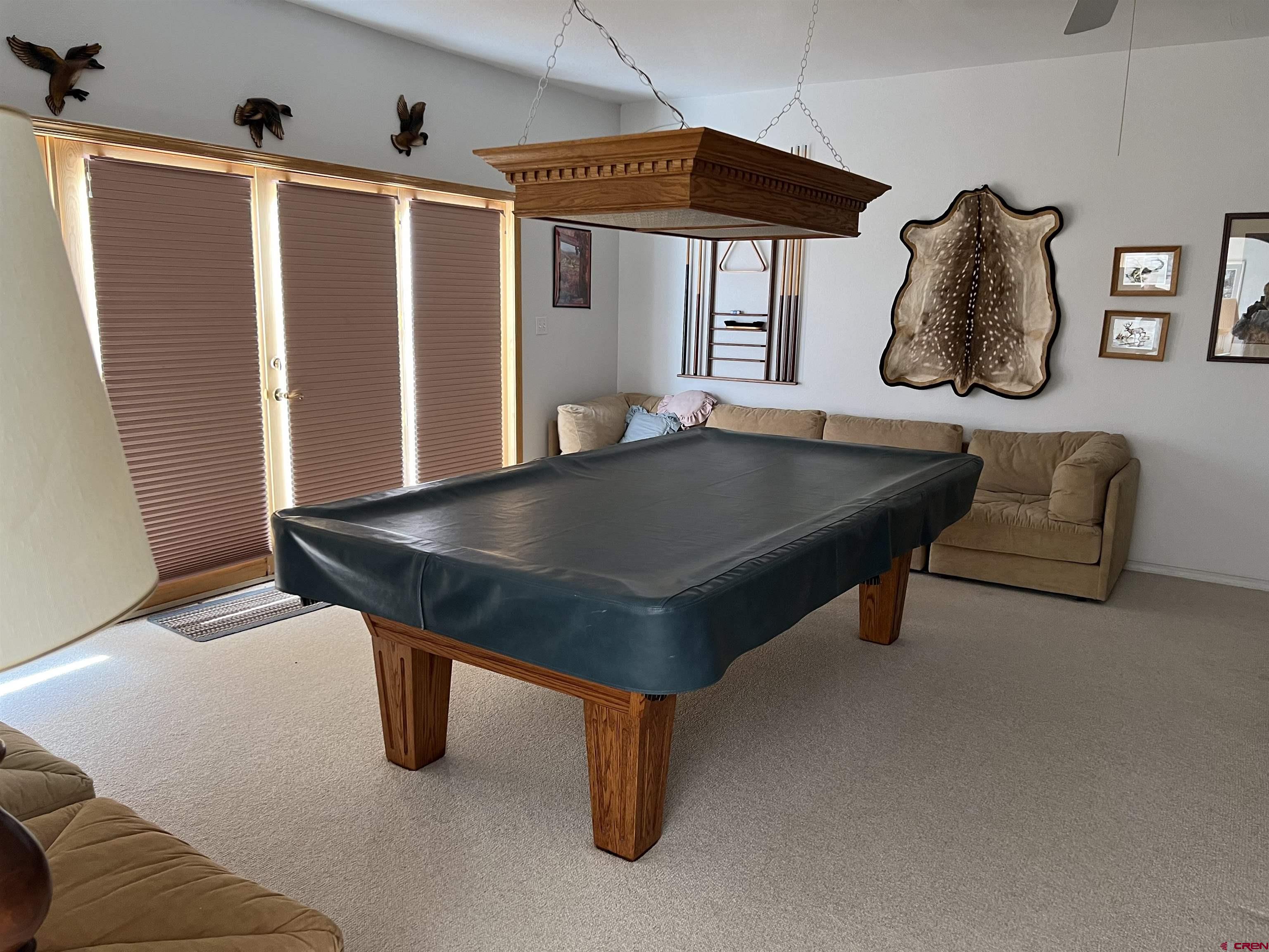 26096 Paintbrush Road Cedaredge, CO 81413 - Photo 14 of 29 a room with furniture and window