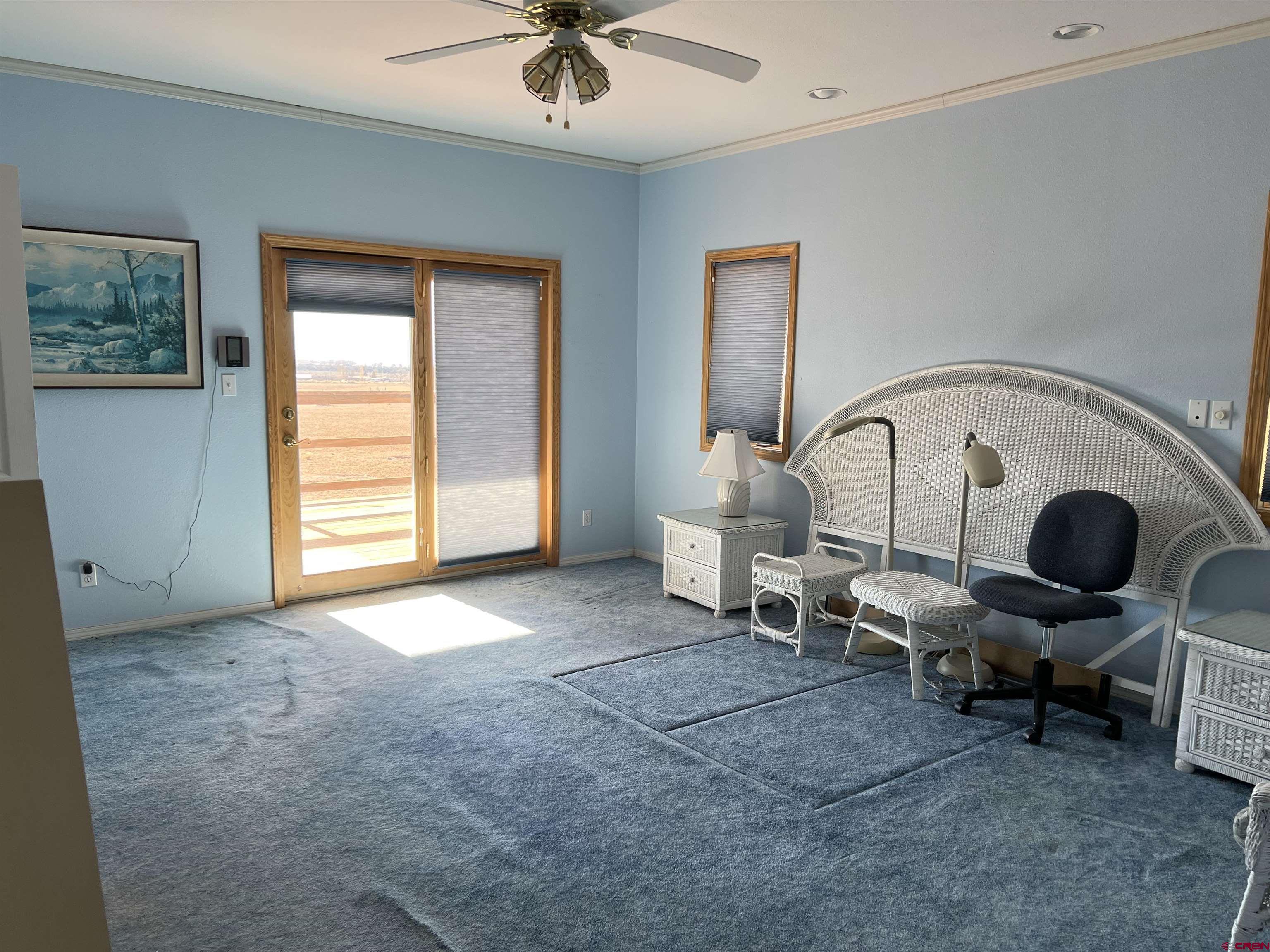 26096 Paintbrush Road Cedaredge, CO 81413 - Photo 18 of 29 a living room with furniture and a window
