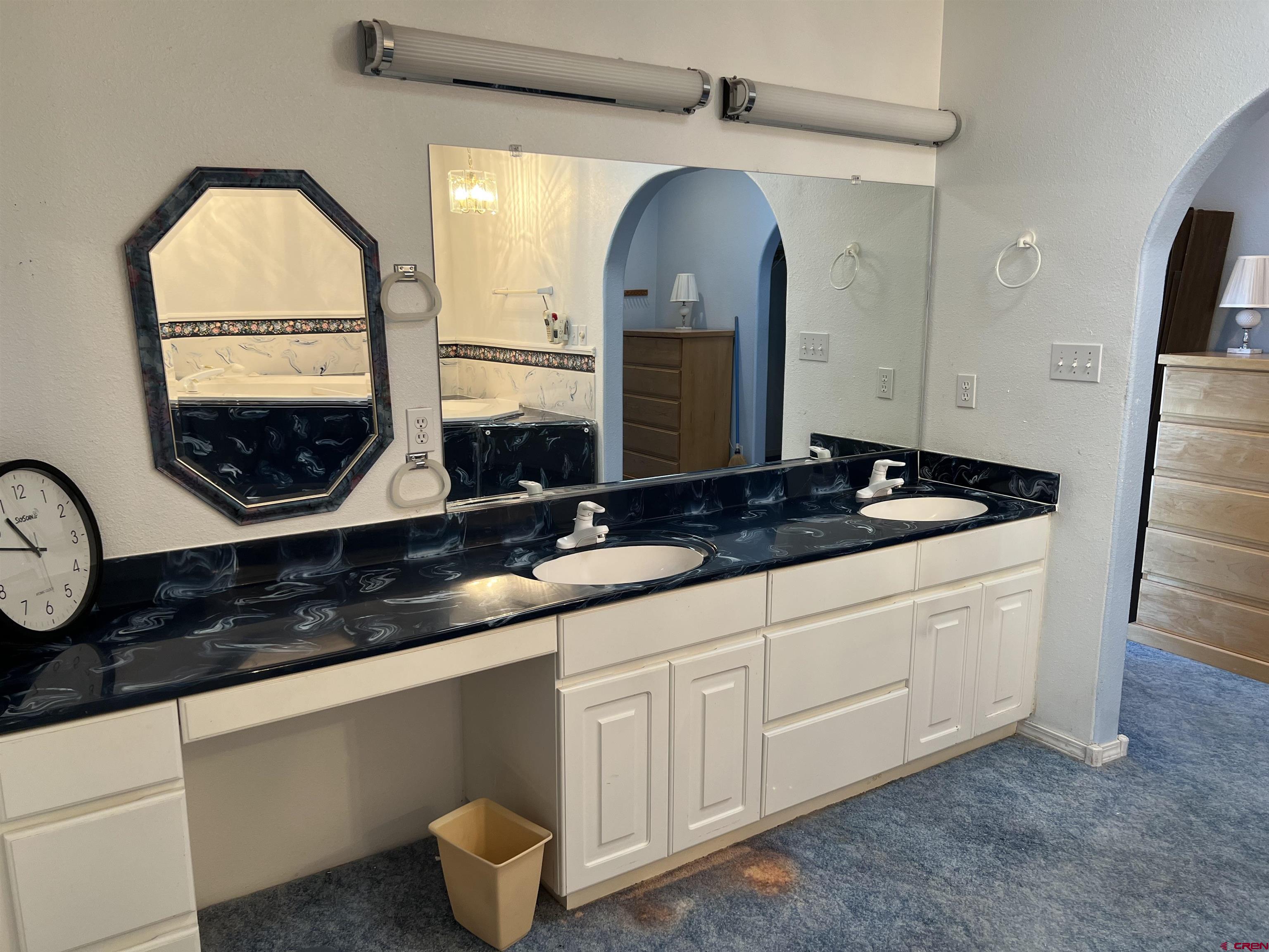 26096 Paintbrush Road Cedaredge, CO 81413 - Photo 19 of 29 a bathroom with a sink and a mirror