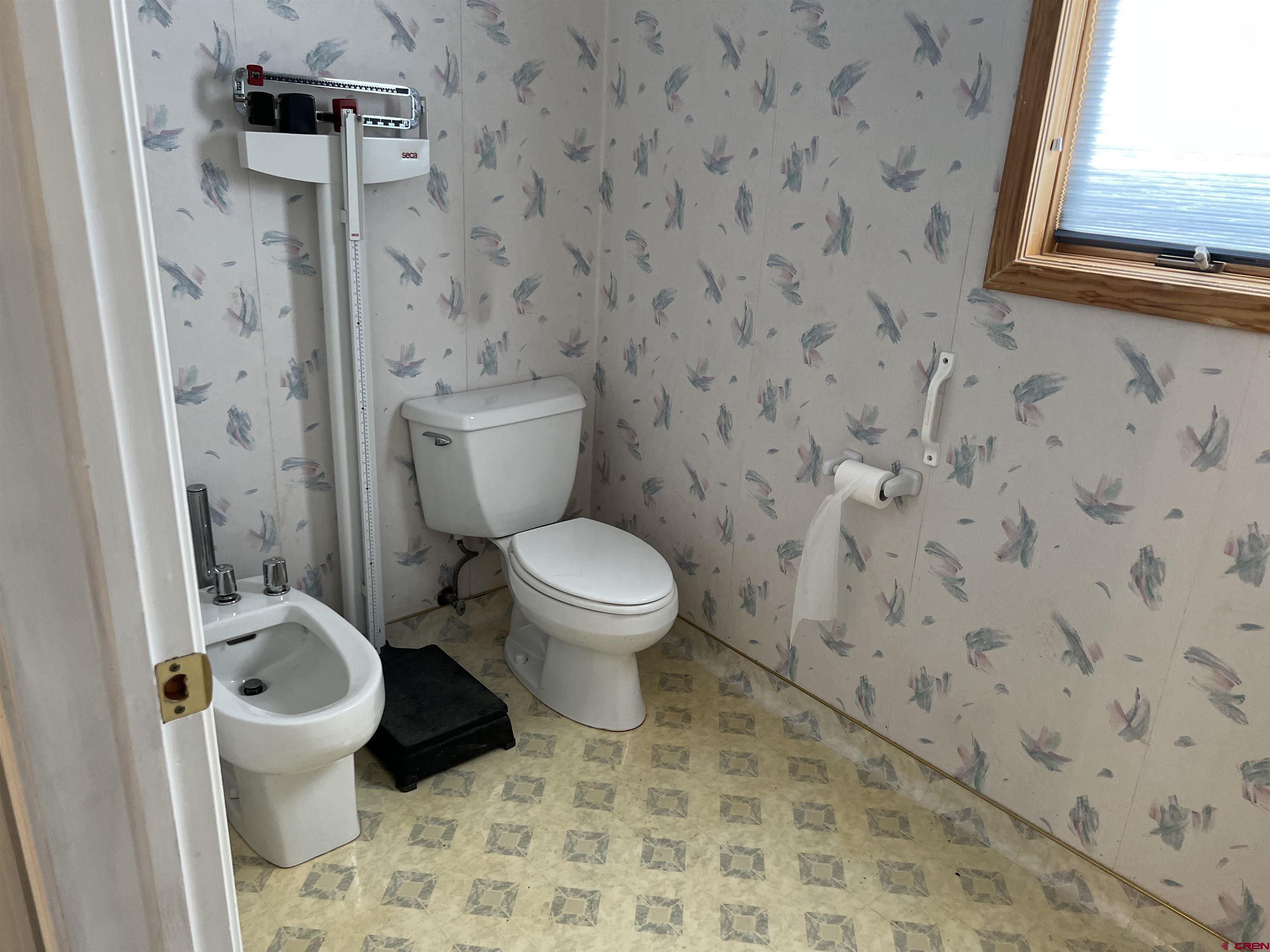 26096 Paintbrush Road Cedaredge, CO 81413 - Photo 21 of 29 a bathroom with a toilet and a shower
