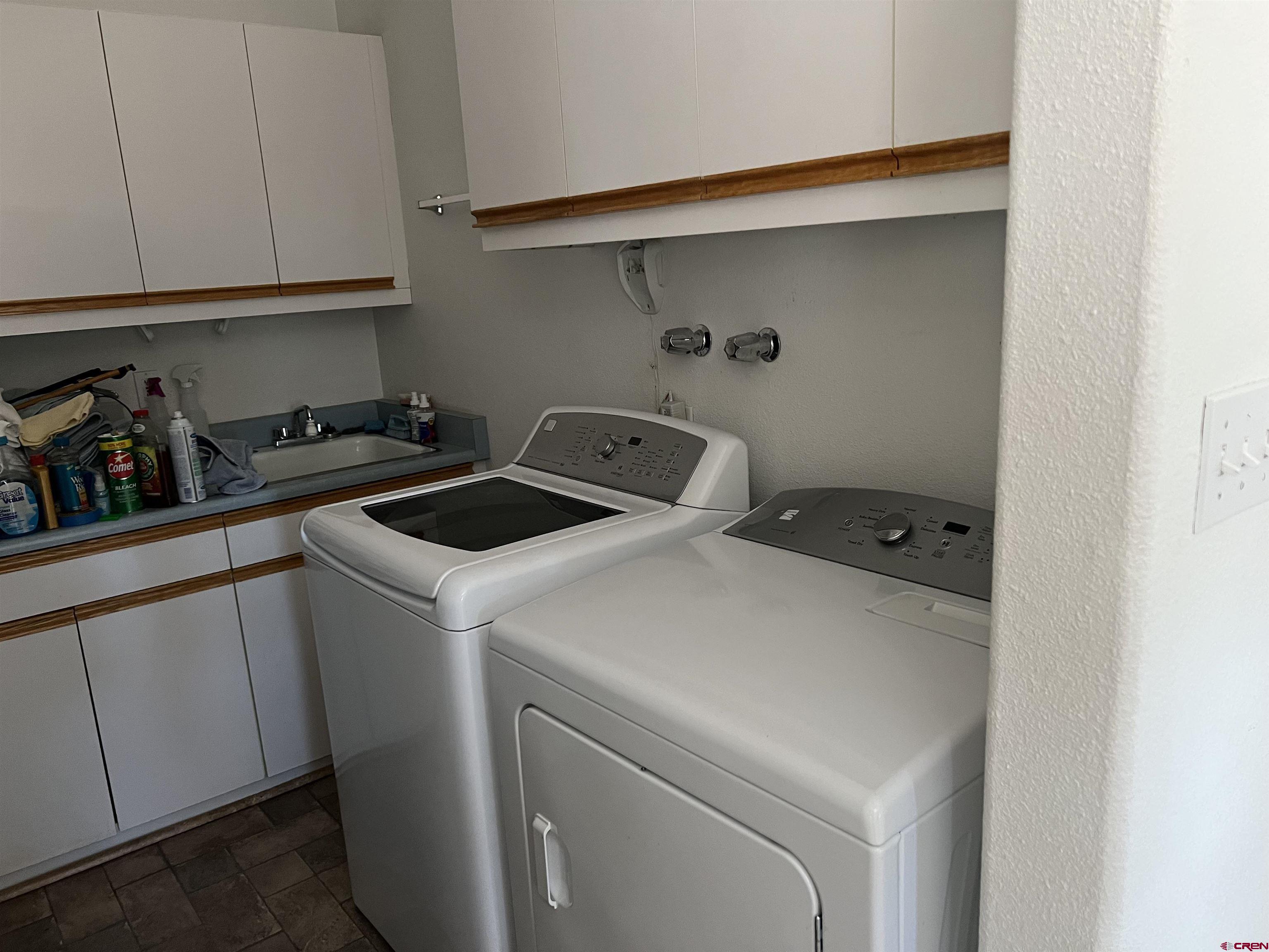 26096 Paintbrush Road Cedaredge, CO 81413 - Photo 25 of 29 a utility room with dryer and washer