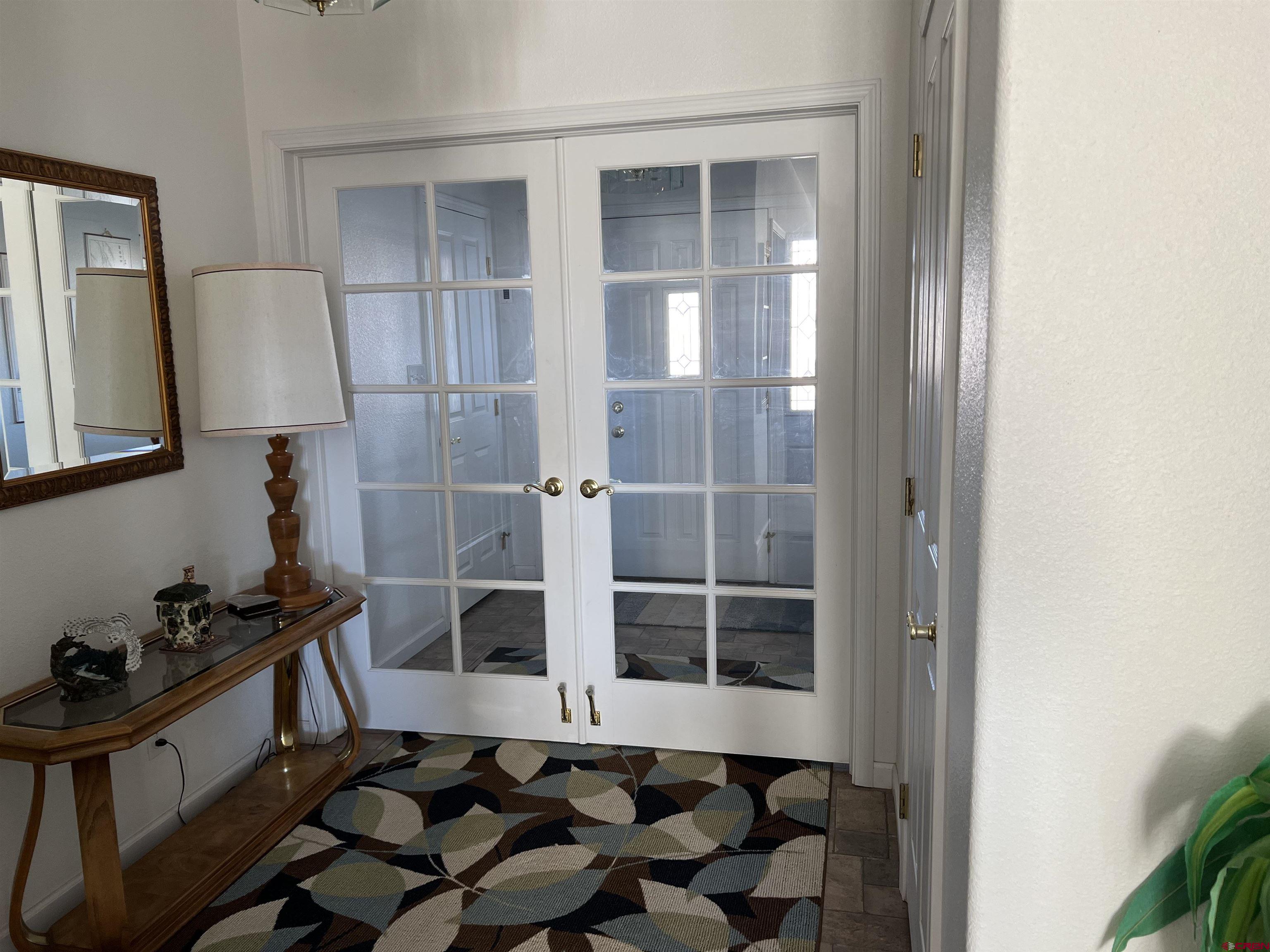 26096 Paintbrush Road Cedaredge, CO 81413 - Photo 3 of 29 a room with furniture and a potted plant