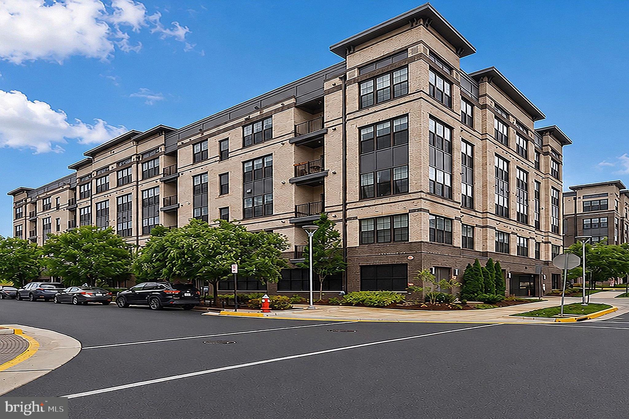 2319 Field Point Road, Unit 102 Herndon, VA 20171 - Photo 1 of 20 a view of a building with a street
