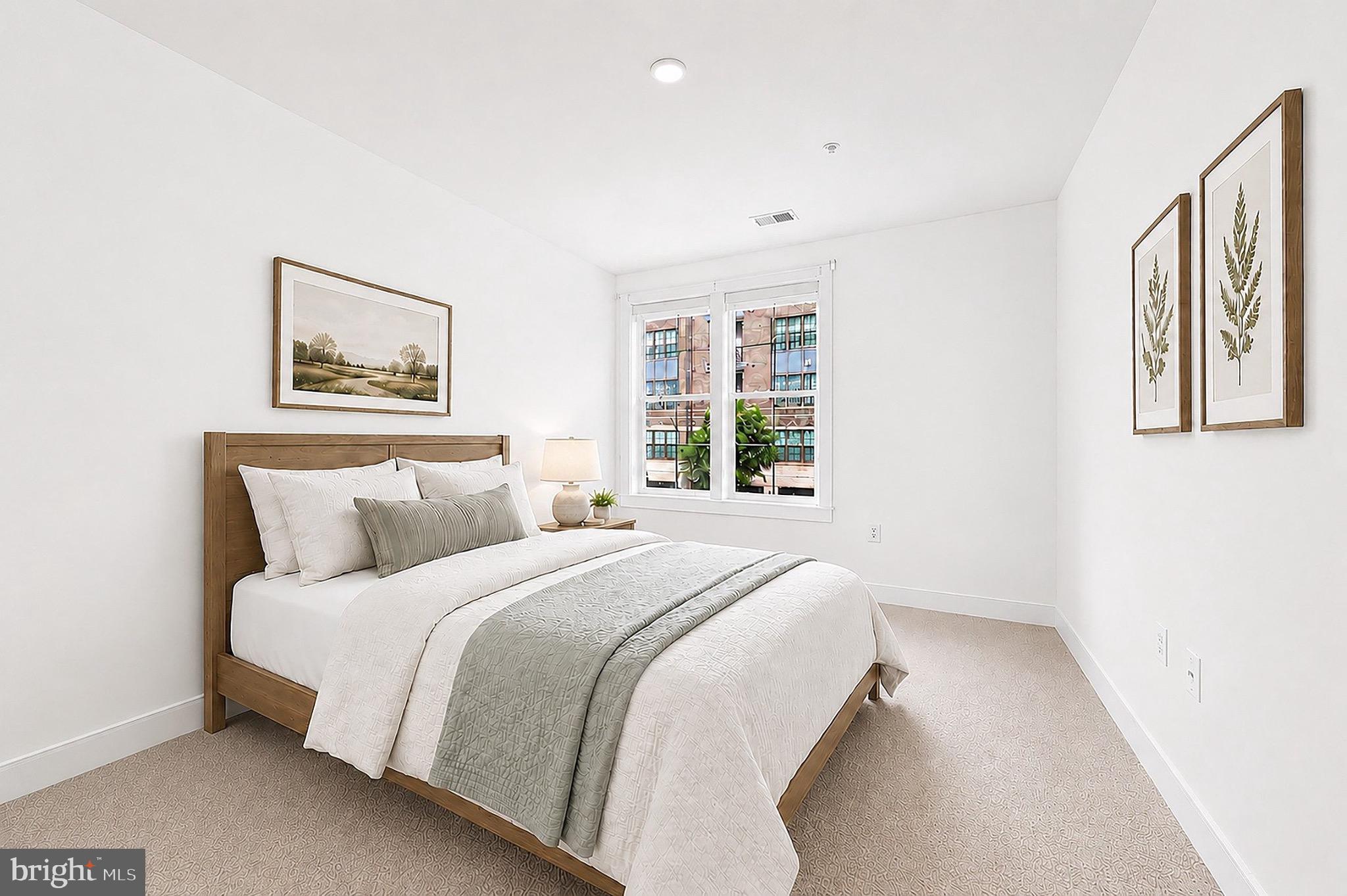 2319 Field Point Road, Unit 102 Herndon, VA 20171 - Photo 16 of 20 a bedroom with a large bed and a window