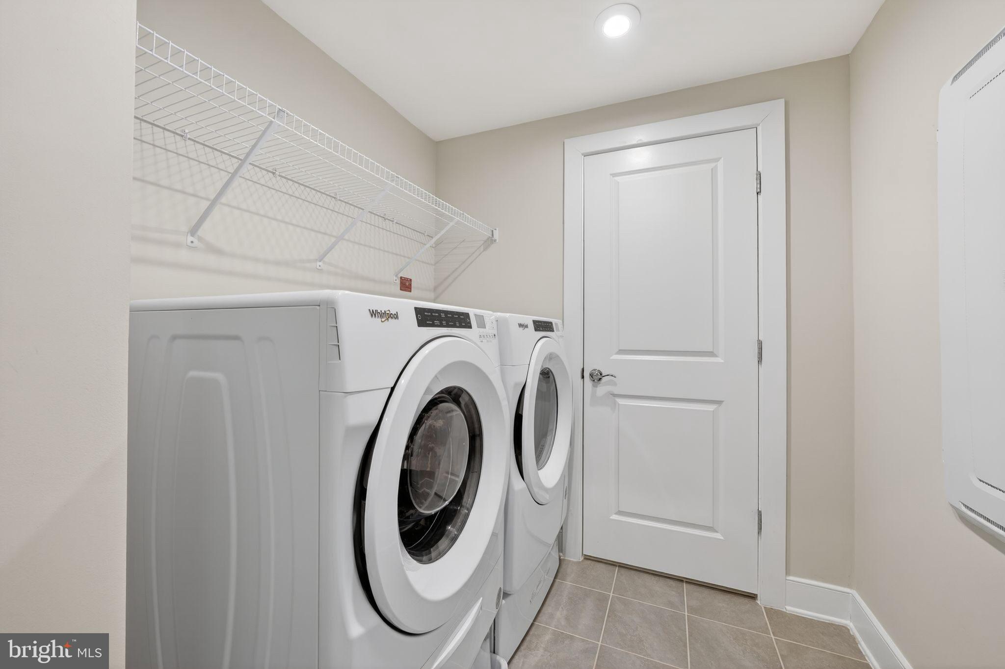 2319 Field Point Road, Unit 102 Herndon, VA 20171 - Photo 18 of 20 a utility room with dryer and washer