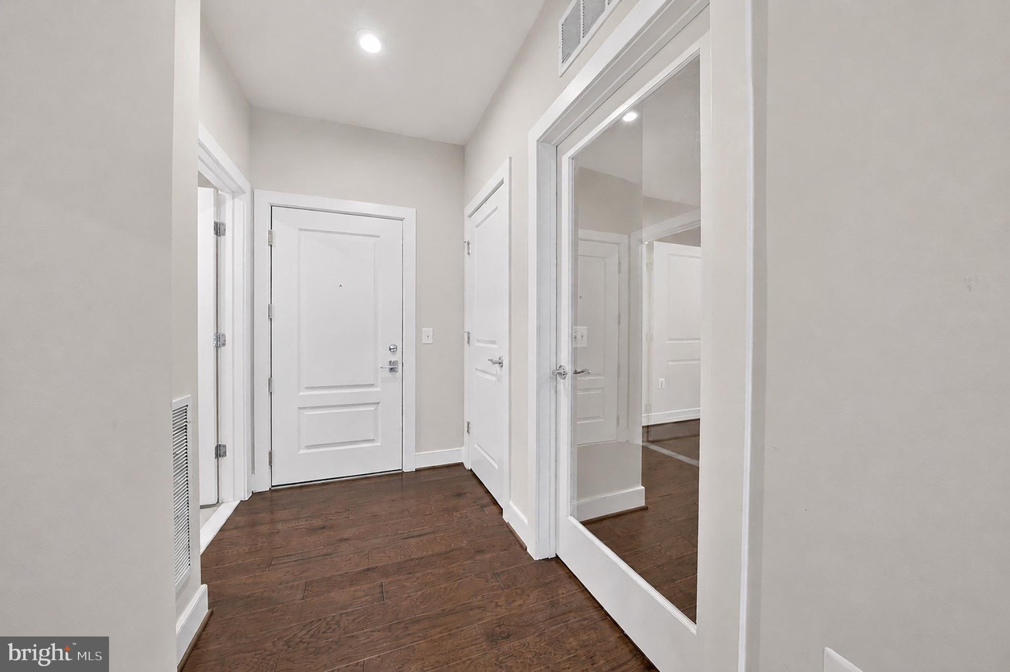 2319 Field Point Road, Unit 102 Herndon, VA 20171 - Photo 4 of 20 a view of a hallway with wooden floor