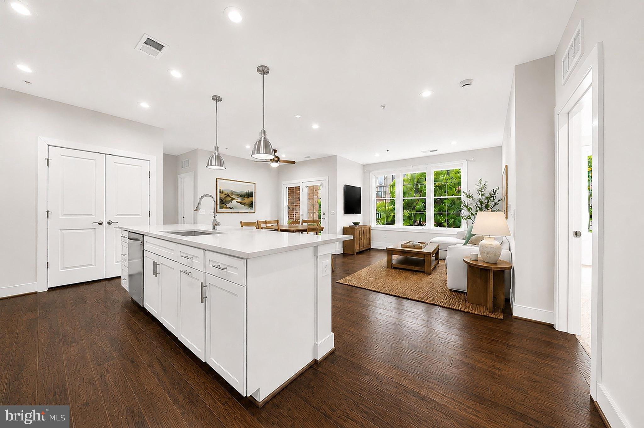 2319 Field Point Road, Unit 102 Herndon, VA 20171 - Photo 6 of 20 a kitchen with counter top space and wooden floor