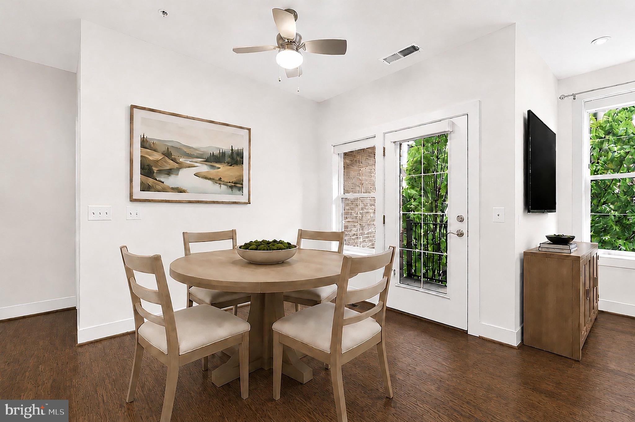 2319 Field Point Road, Unit 102 Herndon, VA 20171 - Photo 10 of 20 a view of a dining room with furniture window and wooden floor