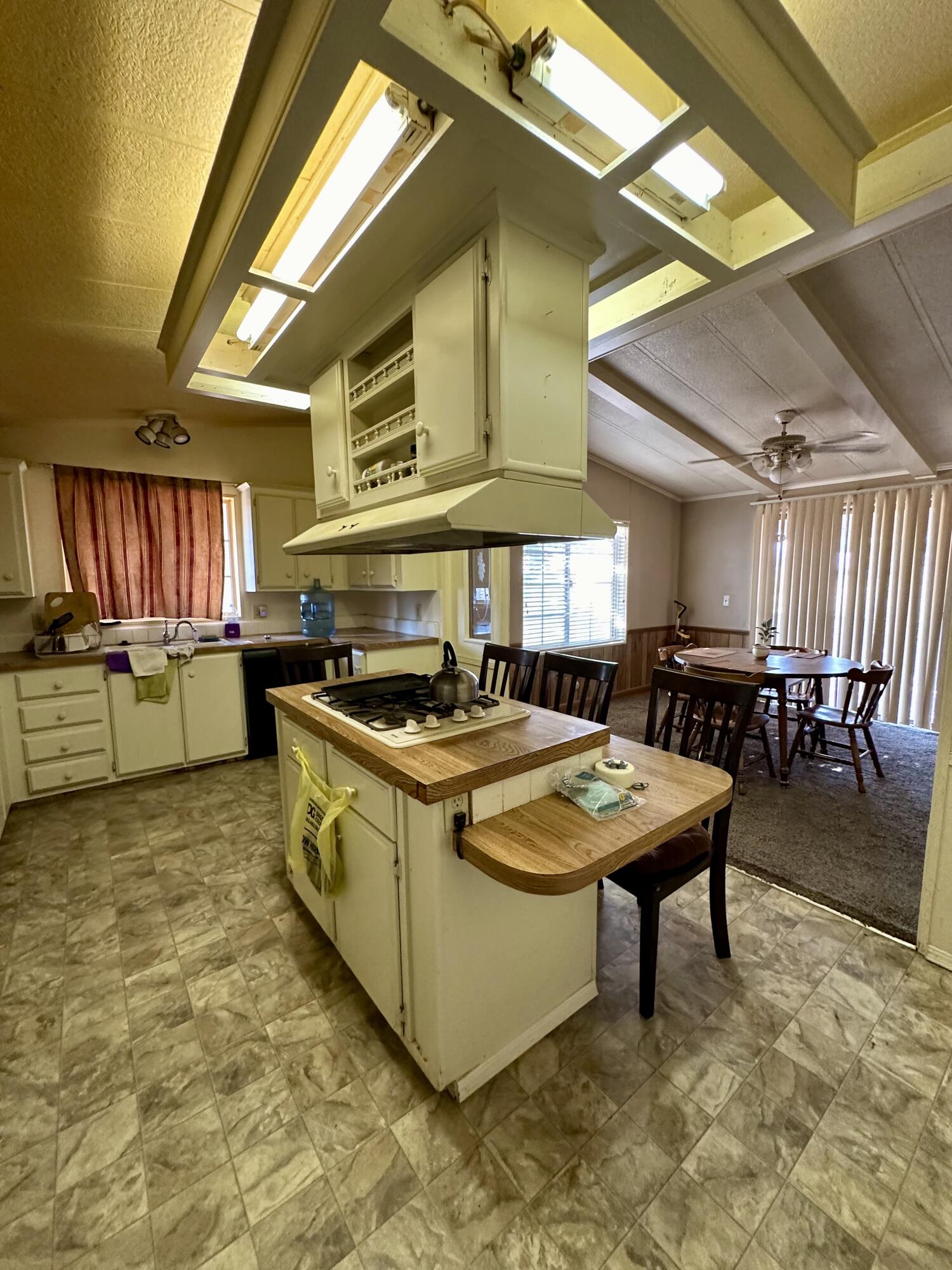 5261 North Intake Boulevard Blythe, CA 92225 - Photo 14 of 14 a kitchen with stainless steel appliances granite countertop a sink and a stove