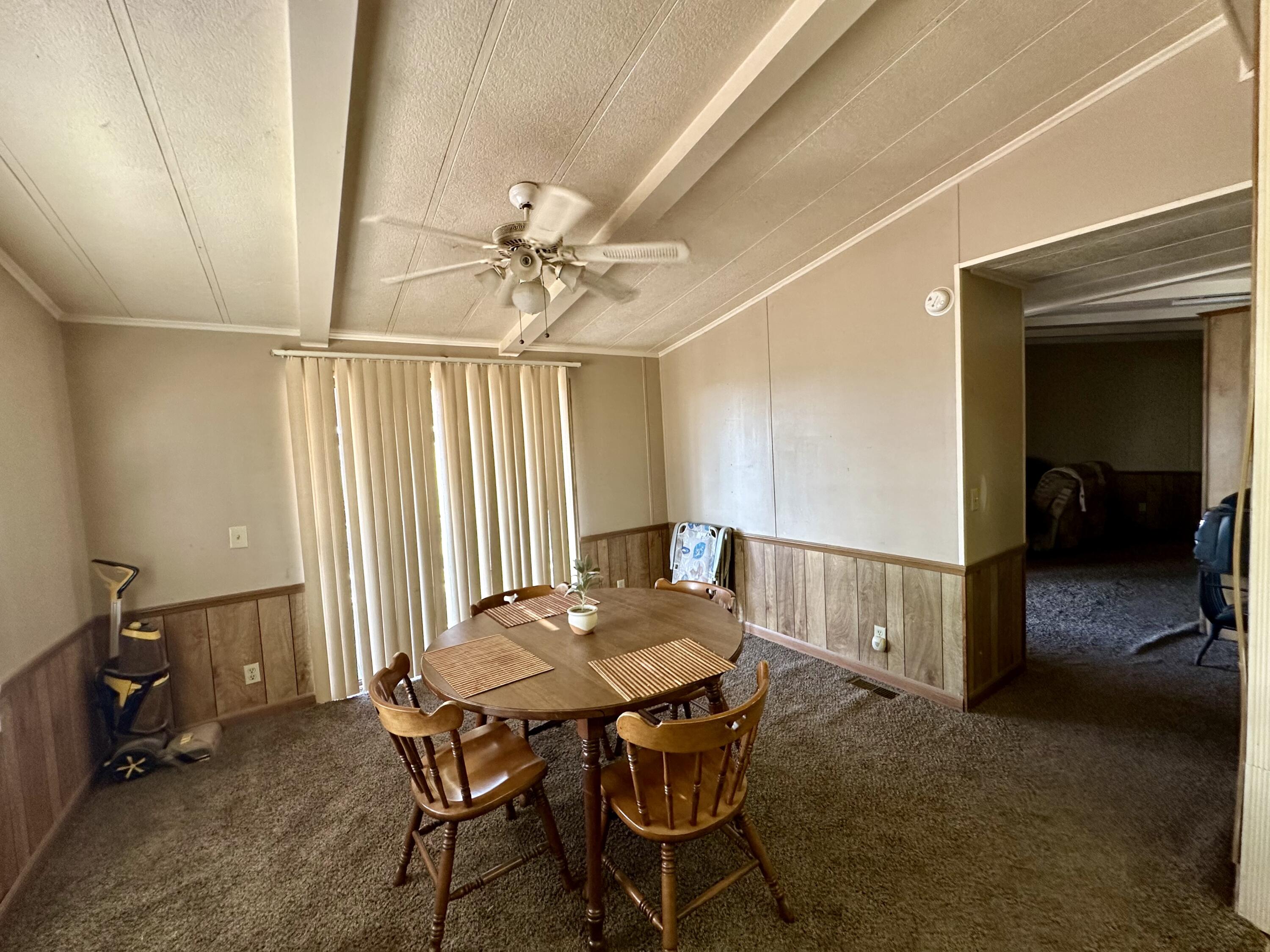 5261 North Intake Boulevard Blythe, CA 92225 - Photo 6 of 14 a view of a dining room with furniture and a chandelier