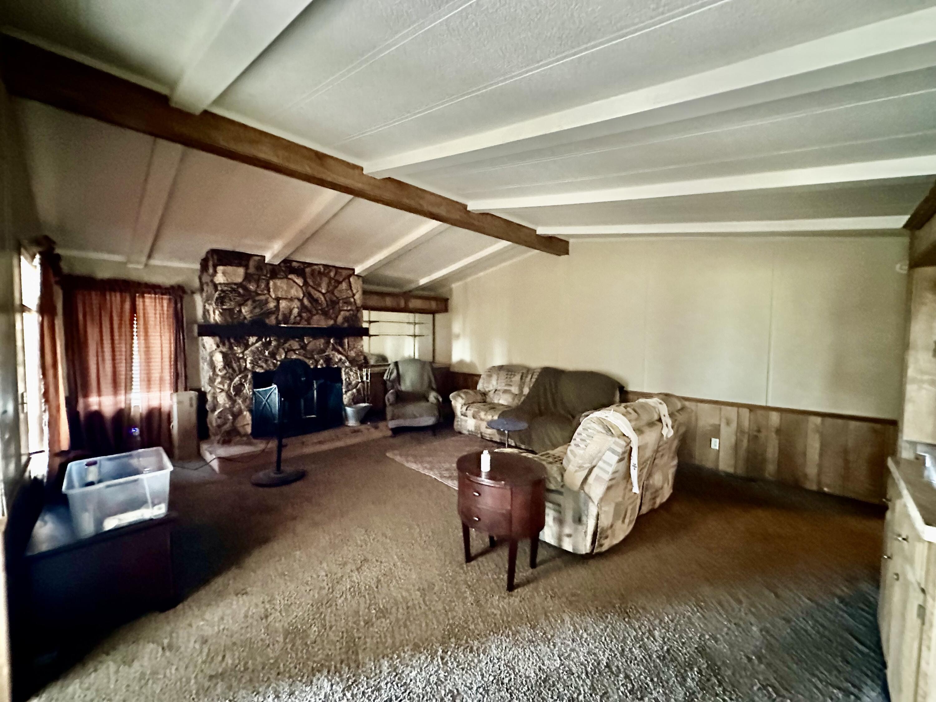 5261 North Intake Boulevard Blythe, CA 92225 - Photo 8 of 14 a bed room with furniture and a fireplace