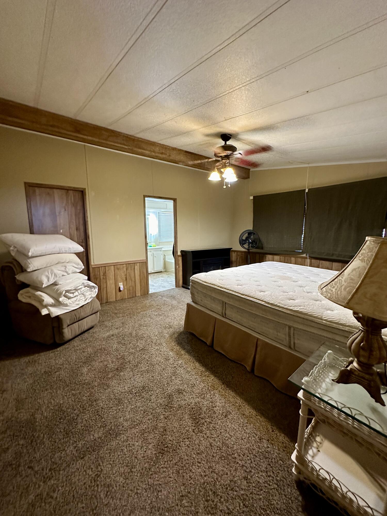 5261 North Intake Boulevard Blythe, CA 92225 - Photo 10 of 14 a bed room with a bed and a chair