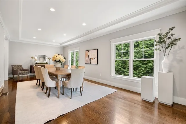 a view of a dining room with furniture and wooden floor