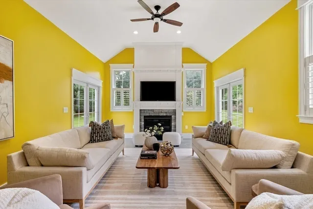 a living room with furniture fireplace and a flat screen tv