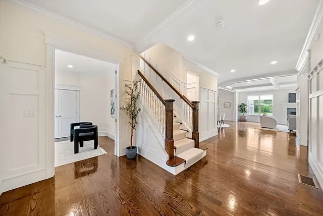 a view of living room with furniture and wooden floor