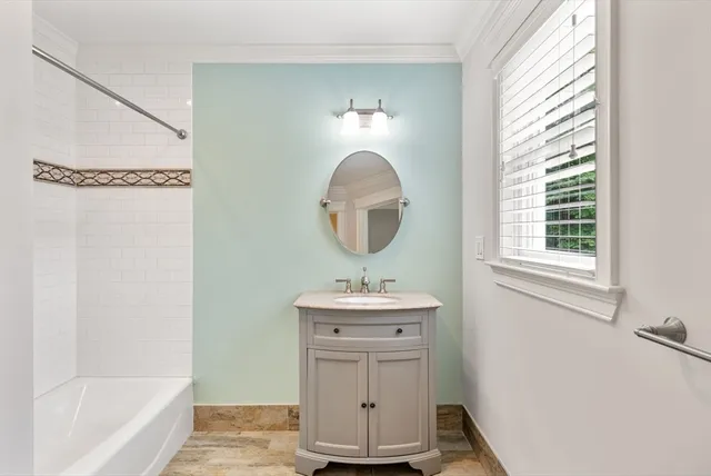 a bathroom with a sink toilet and bathtub