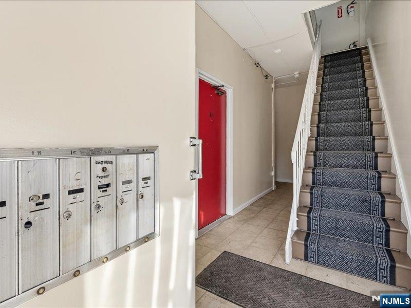 467 Hudson Street Hackensack, NJ 07601 - Photo 4 of 13 a view of an entryway with staircase