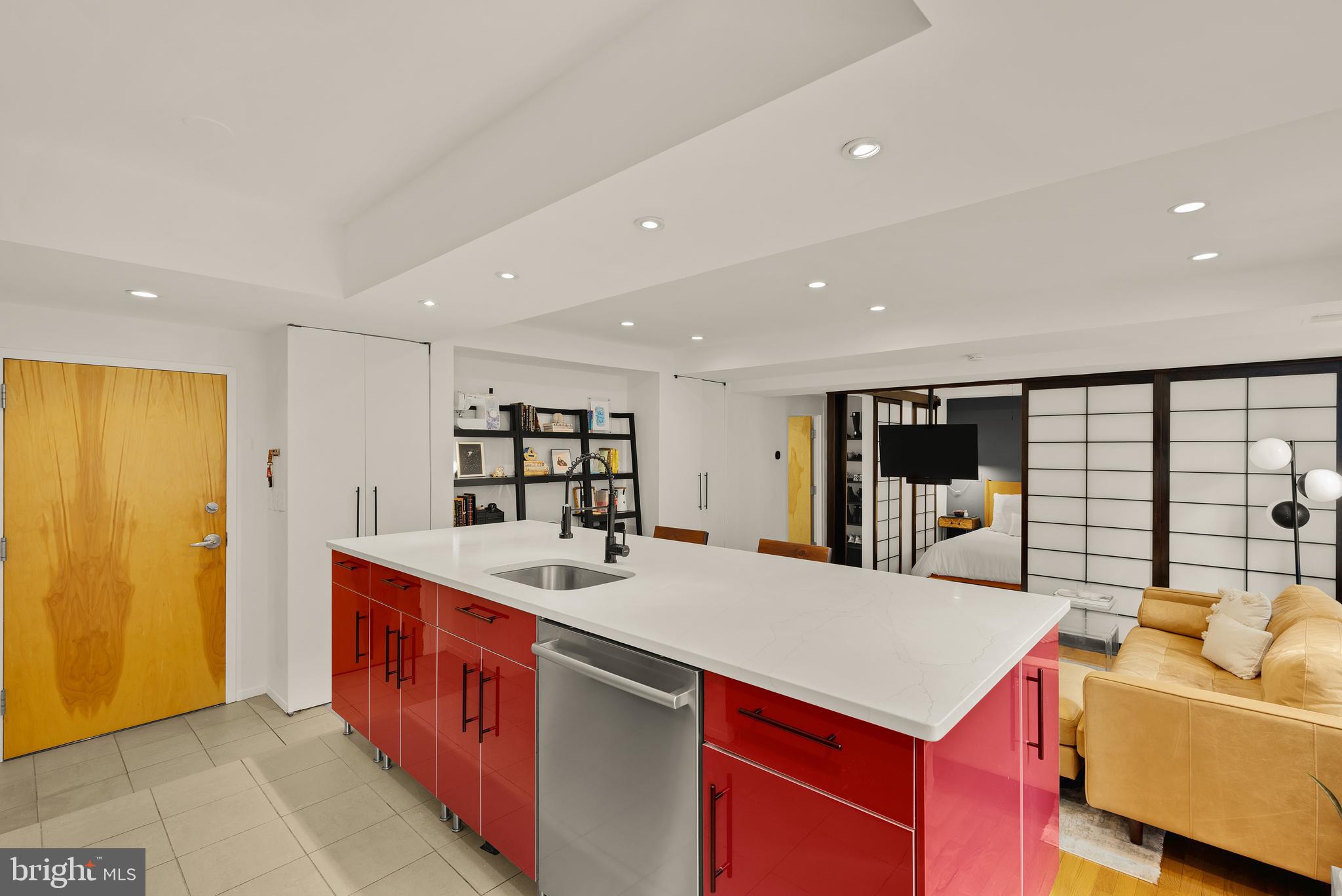 2370 Champlain Street Northwest, Unit 21 Washington, DC 20009 - Photo 9 of 22 a large living room with stainless steel appliances granite countertop a sink a counter top space and living room view