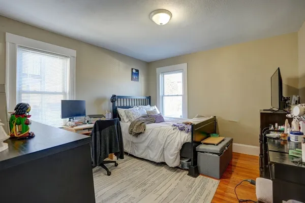 a bedroom with a workspace