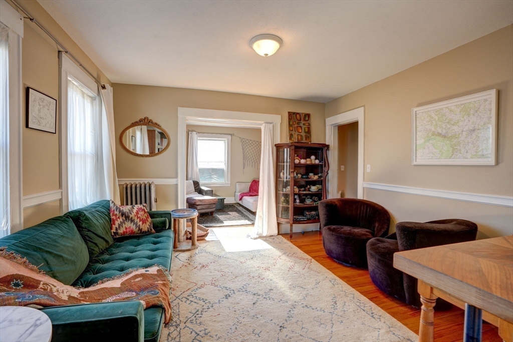 77 2nd Street, Unit 2 Medford, MA 02155 - Photo 10 of 18 a living room with furniture and a large window