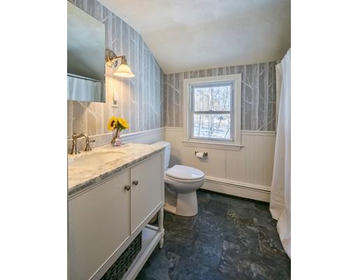 72 Ortins Road Hamilton, MA 01982 - Photo 28 of 30 a spacious bathroom with a granite countertop toilet a sink and a mirror