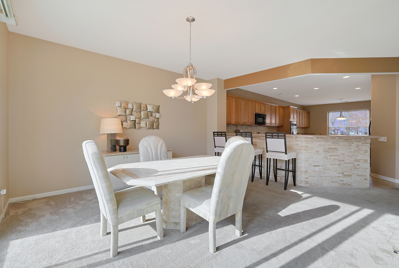 13767 Guilford Road Huntley, IL 60142 - Photo 11 of 34 a view of a dining room with furniture and wooden floor