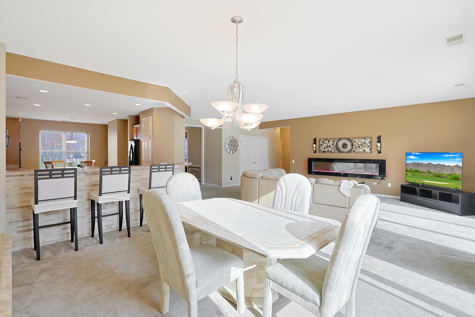 13767 Guilford Road Huntley, IL 60142 - Photo 12 of 34 a view of a dining room with furniture and a chandelier