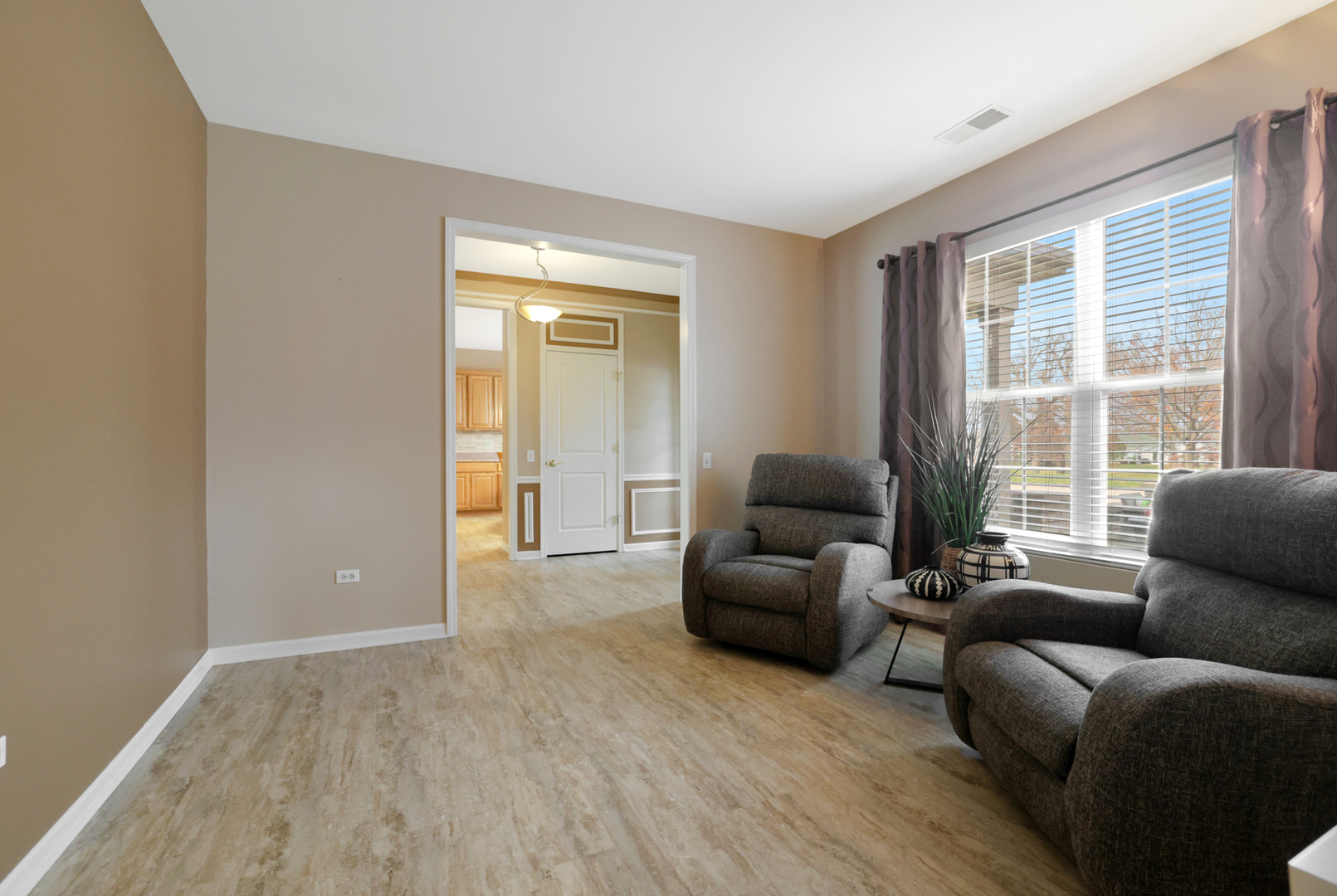 13767 Guilford Road Huntley, IL 60142 - Photo 17 of 34 a living room with furniture and a large window