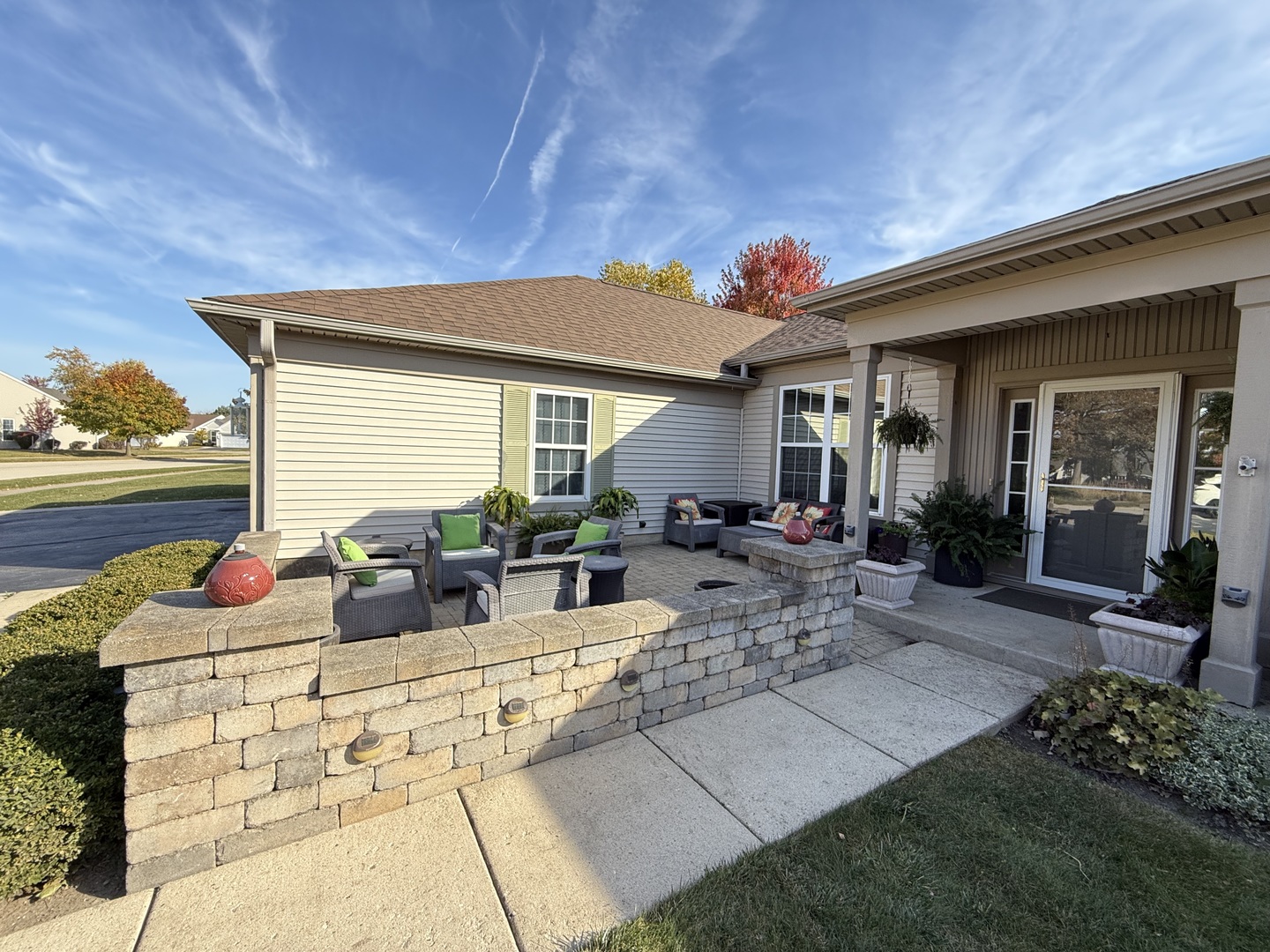 13767 Guilford Road Huntley, IL 60142 - Photo 2 of 34 a view of outdoor kitchen with dining table and chairs