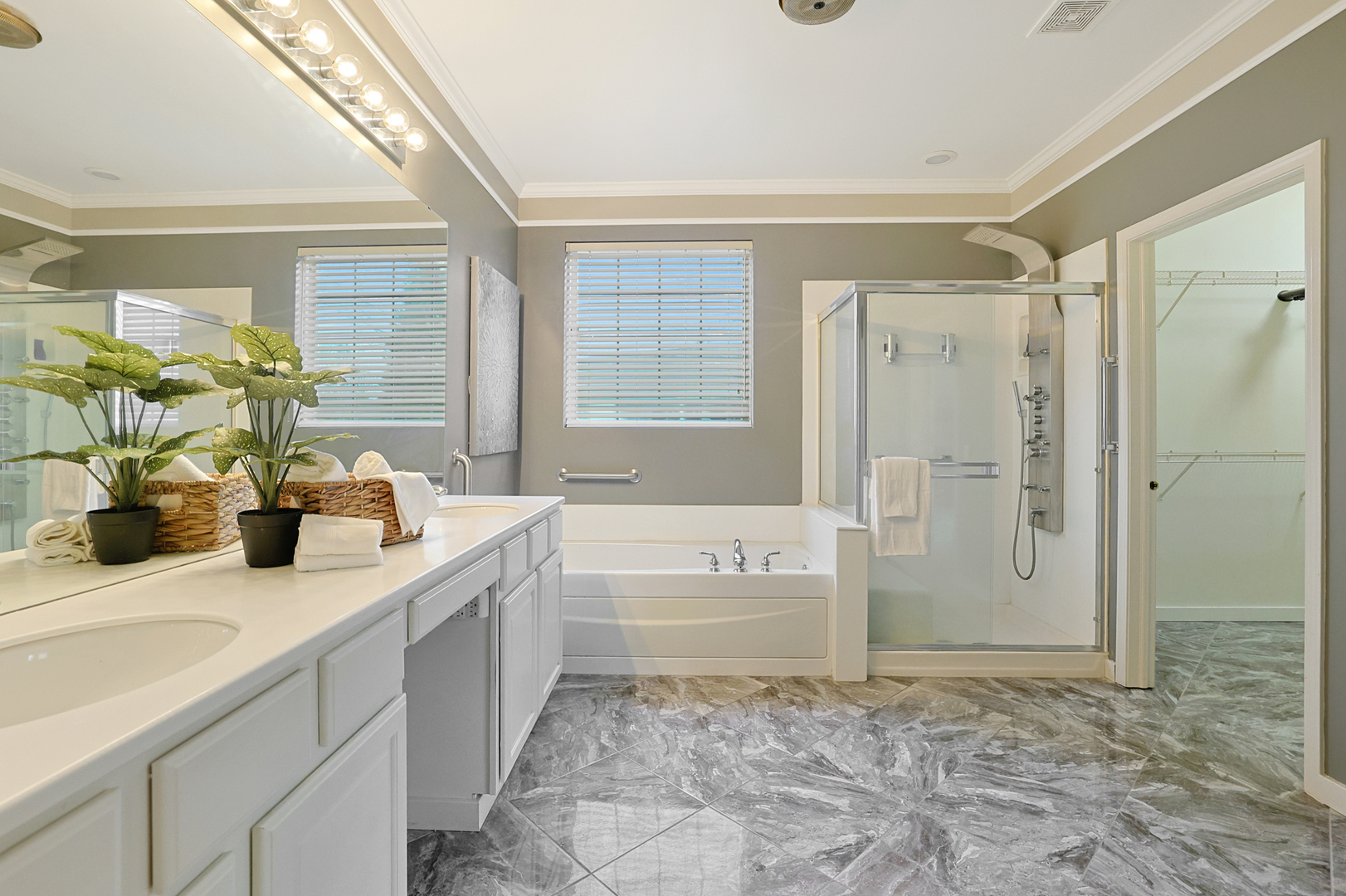 13767 Guilford Road Huntley, IL 60142 - Photo 23 of 34 a bathroom with a tub sink and mirror