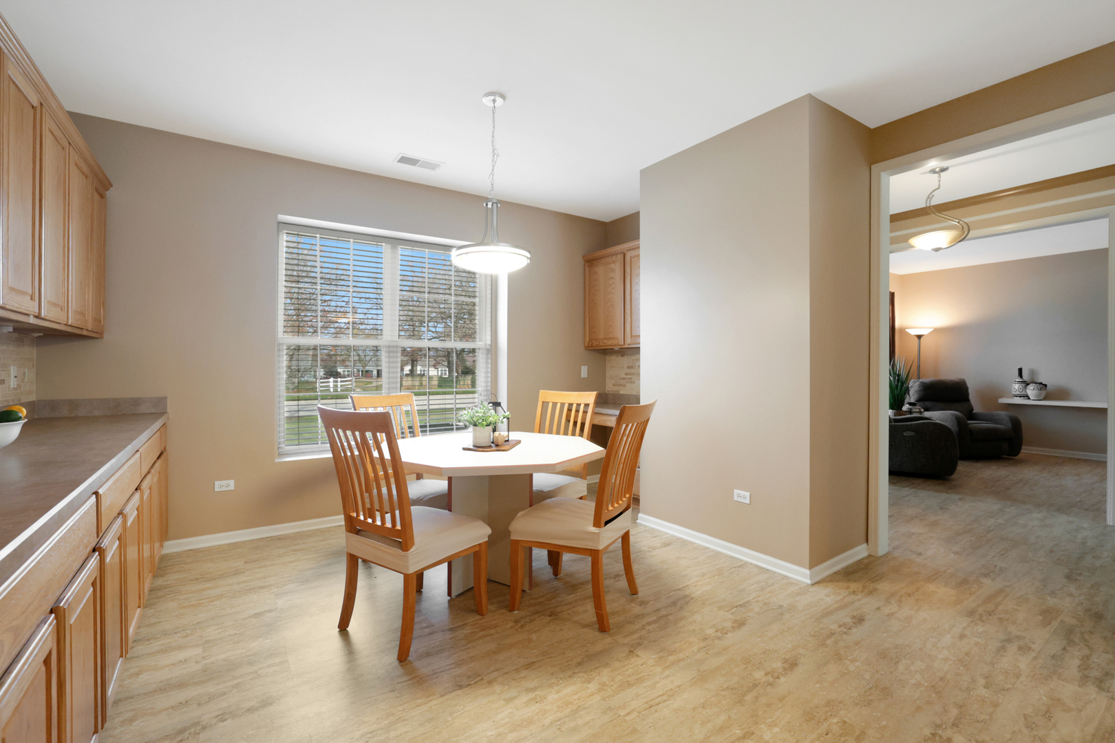 13767 Guilford Road Huntley, IL 60142 - Photo 7 of 34 a view of a dining room with furniture window and outside view