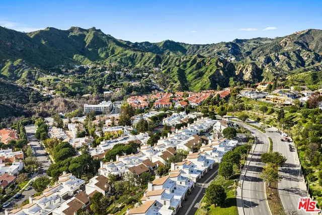 a view of a balcony with furniture