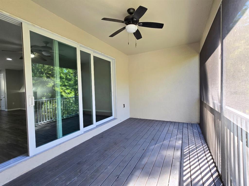 807 Callista Cay Loop Tarpon Springs, FL 34689 - Photo 26 of 32 a view of an empty room with wooden floor and a window