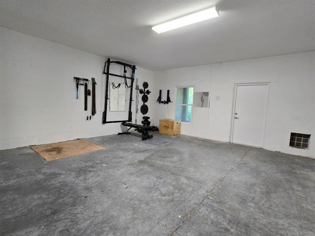 807 Callista Cay Loop Tarpon Springs, FL 34689 - Photo 30 of 32 a view of a room with gym equipment