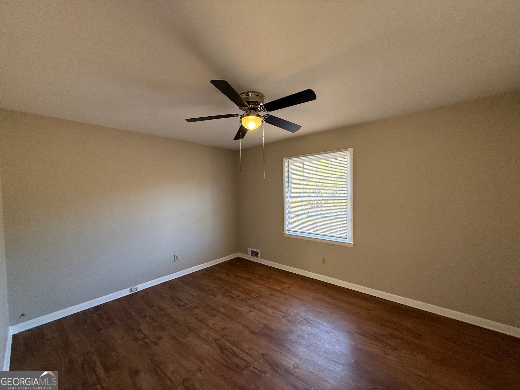 100 Citation Court Athens, GA 30605 - Photo 7 of 13 an empty room with wooden floor and ceiling fan