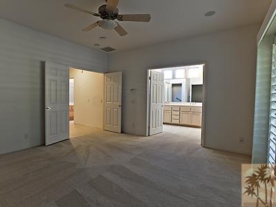 5 White Sun Way Rancho Mirage, CA 92270 - Photo 13 of 24 a view of a big room with chandelier fan and windows