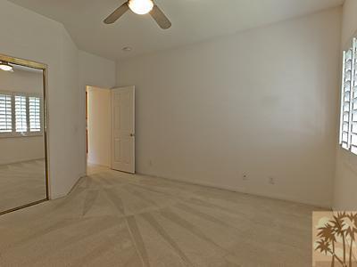 5 White Sun Way Rancho Mirage, CA 92270 - Photo 20 of 24 an empty room with chandelier fan