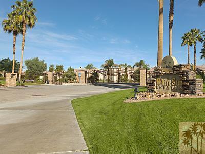 5 White Sun Way Rancho Mirage, CA 92270 - Photo 2 of 24 a view of a garden with a building in the background